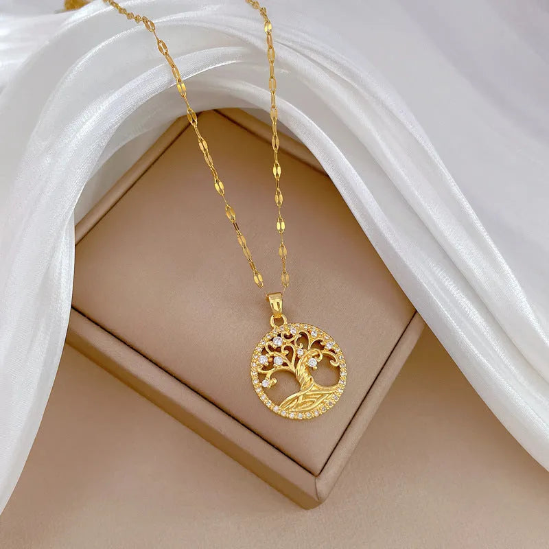 Gold plated Lucky Tree Light necklace with rhinestone details and a Mother Pearl pendant on an adjustable chain.