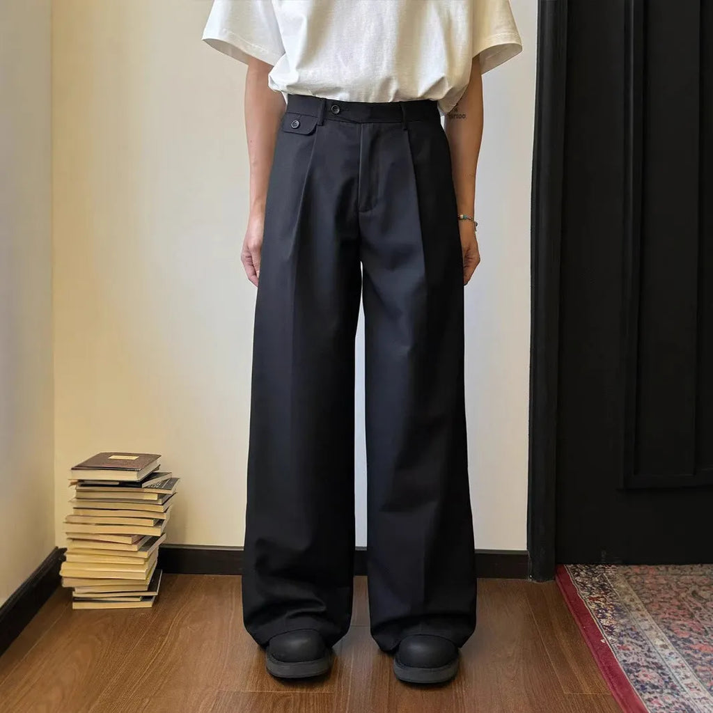 Men's straight-leg casual trousers in polyester blend fabric showing drape and wider cut design