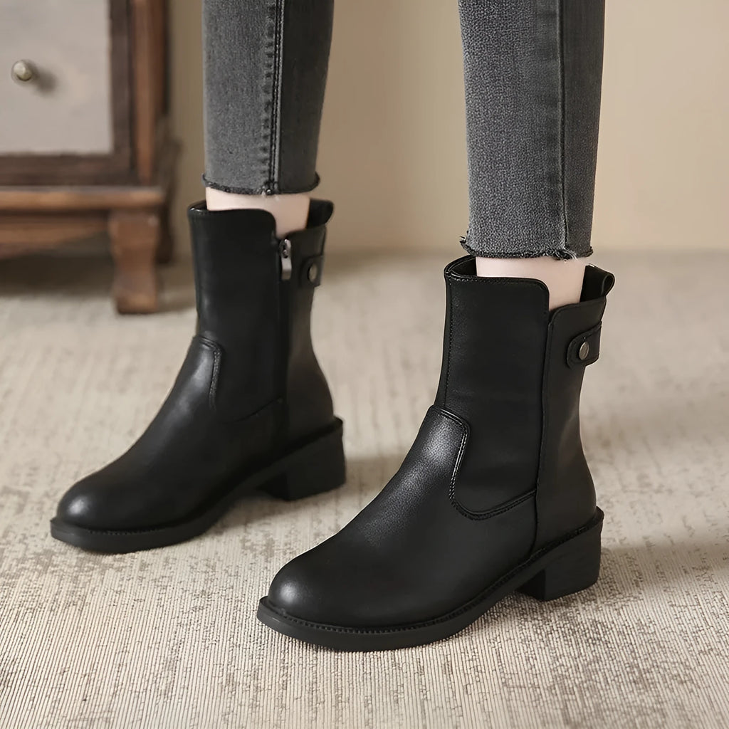 Black women's low heel side zip ankle boots with round toe on a white background.