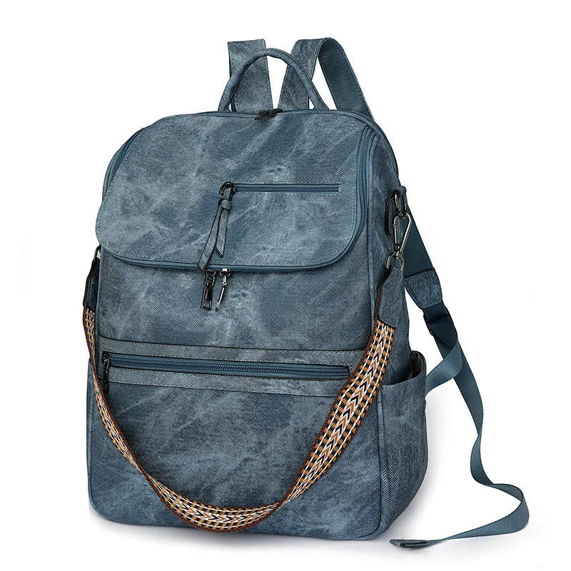 Retro college backpack in PU material with a curved shoulder strap shown in multiple colour options.