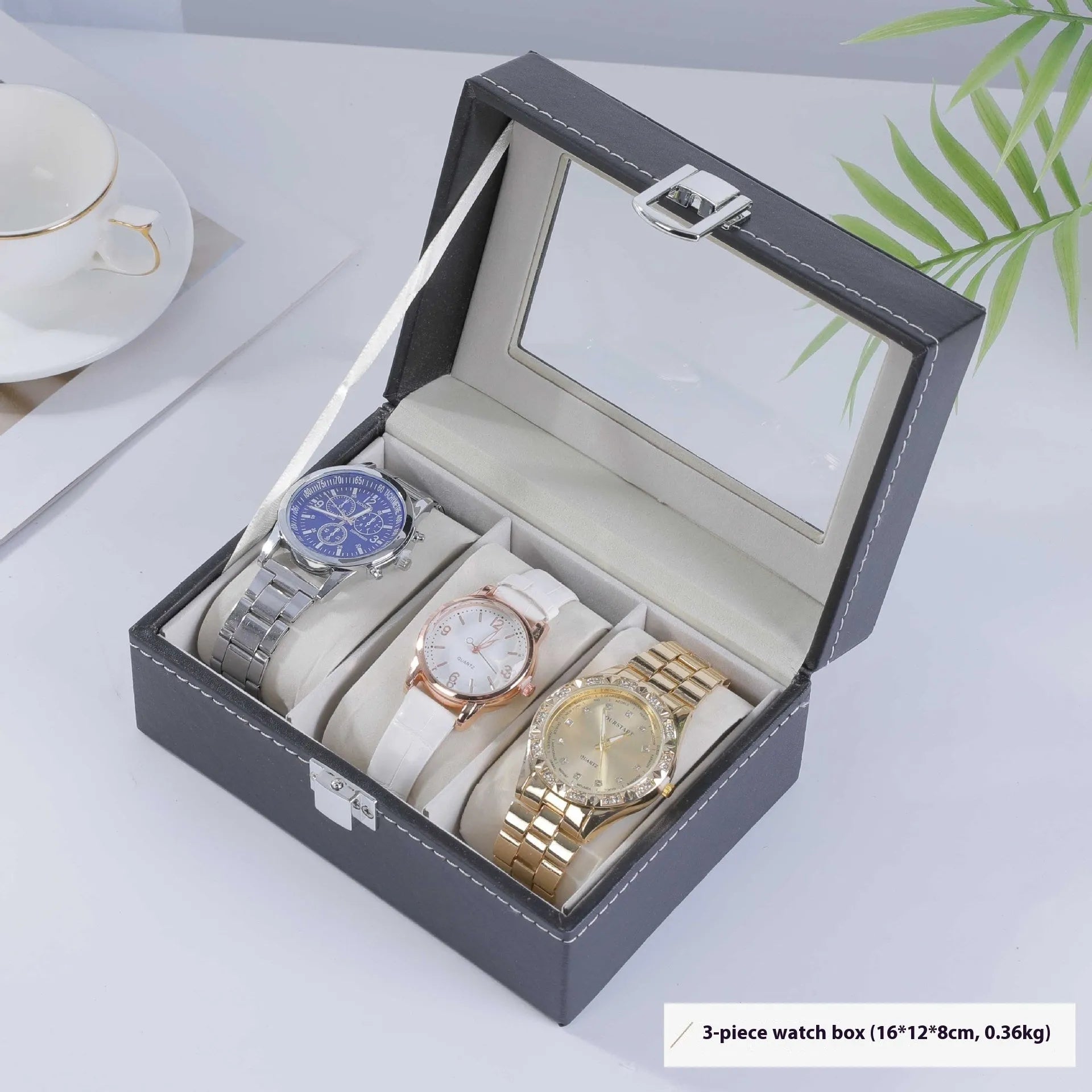Grey leather watch storage box with transparent lid showing multiple watch slots inside