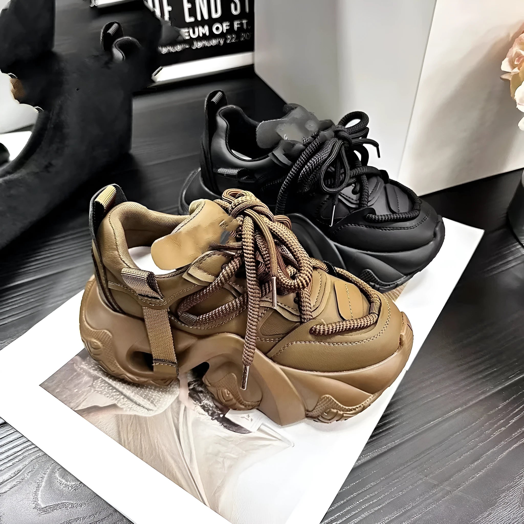 Women's creamy white platform sneakers with wedge heel, cross-strap detail, and lace-up front.