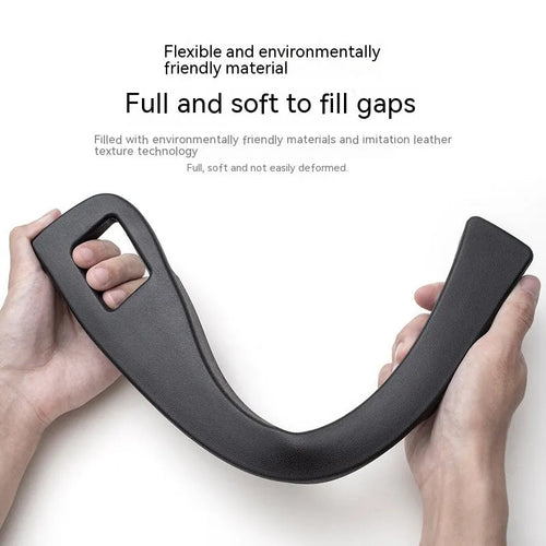 Black car gap storage box with handle positioned between car seats