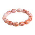 Natural cherry agate barrel bead bracelet with ruyi design elements measuring 10x14mm