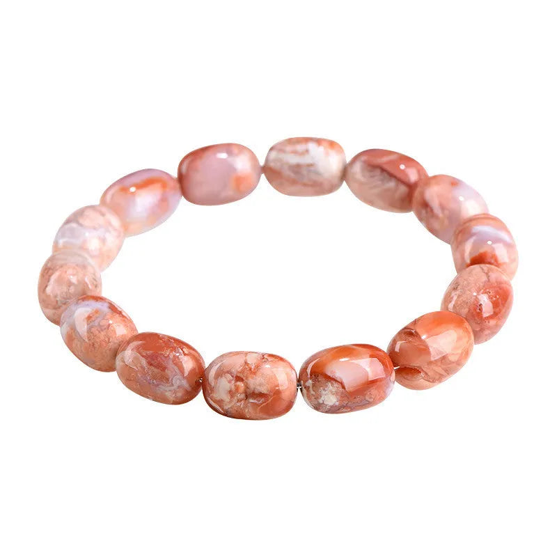 Natural cherry agate barrel bead bracelet with ruyi design elements measuring 10x14mm