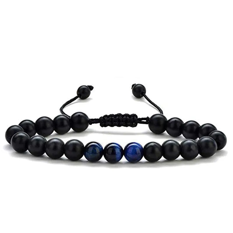Geometric couple bracelet made of matte black agate beads with a tiger eye stone.