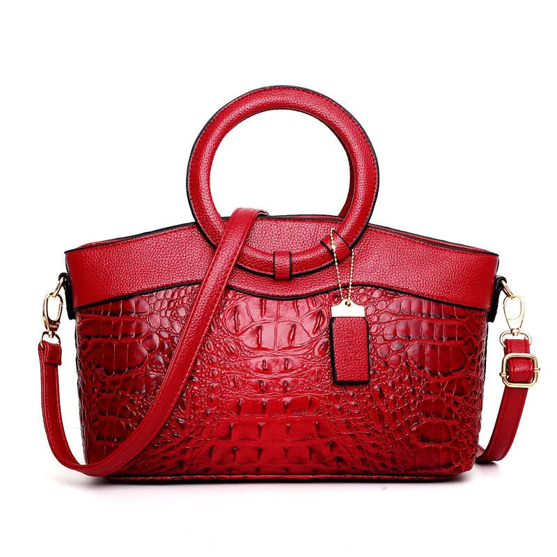 Fabric ladies handbag showing multiple compartments including phone and ID sections