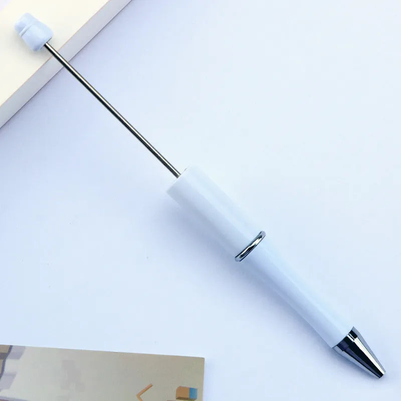 Creative ballpoint pen with multicoloured spinning plastic beads on a steel wire frame.