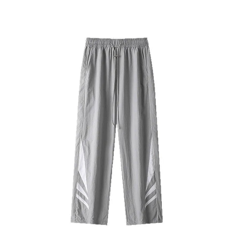 Men's straight cut casual trousers in black with elastic waistband and cardigan button detail