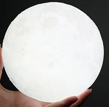 3D printed white moon lamp on wooden stand with touch metal ring at base