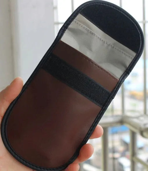 Black microfiber Faraday cage bag for blocking car key fob and RFID signals.