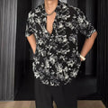 Loose casual short sleeve shirt with floral pattern in black or white colour options