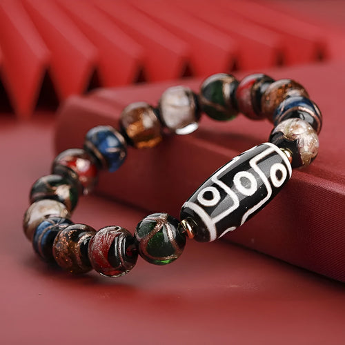 Chinese-style coloured glaze bracelet with five-colour design and Year of the Snake lucky beads.