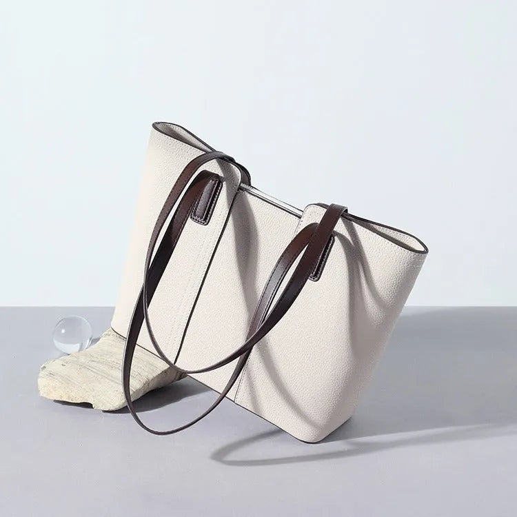 Genuine leather women's commuter shoulder bag in box-type shape with sewing line detailing and mobile phone compartment