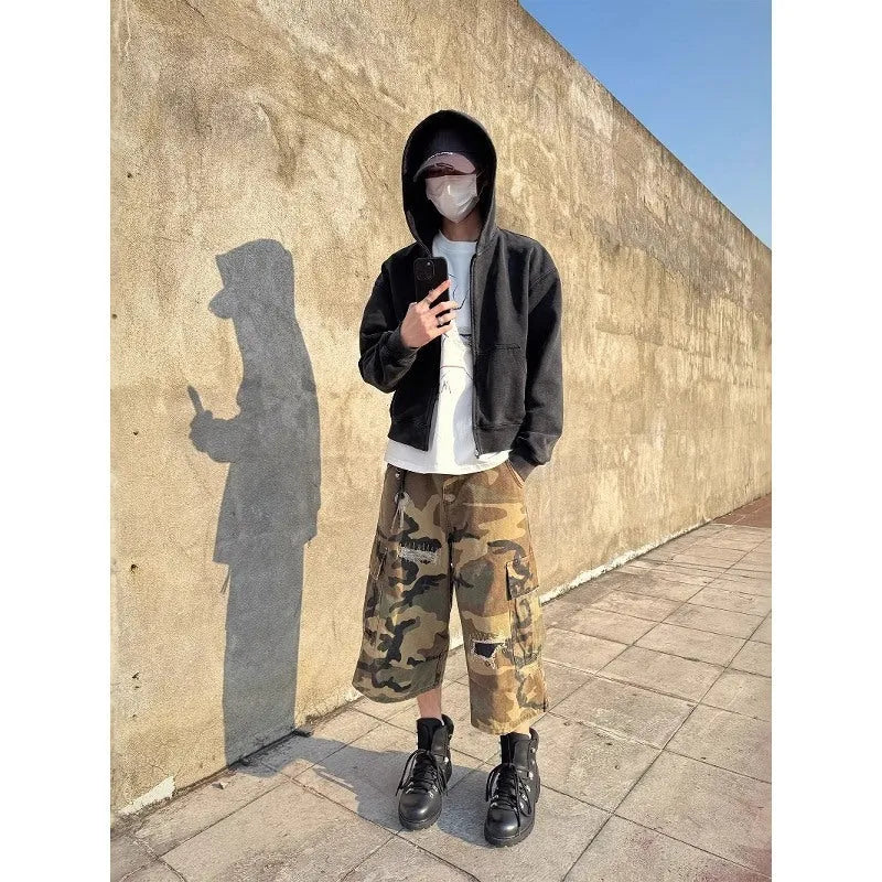 Men's camouflage pattern cropped jeans with distressed patches and straight leg cut