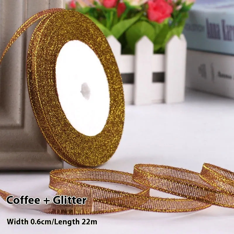 Roll of polyester gift ribbon showing 0.6cm width and multiple colour options including metallic finishes