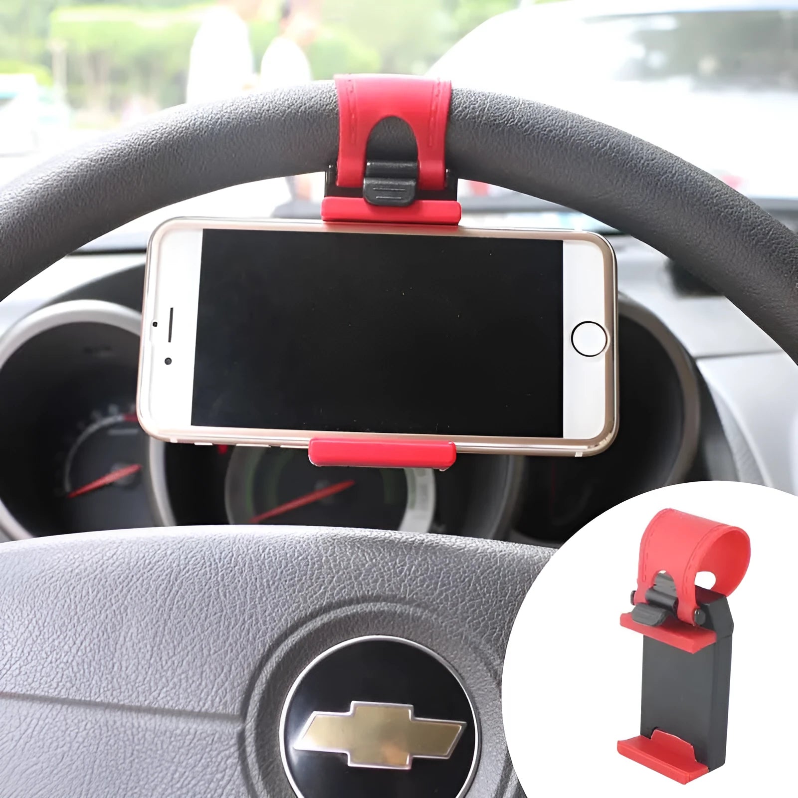 Black steering wheel phone holder clip mounted on car steering wheel holding a smartphone
