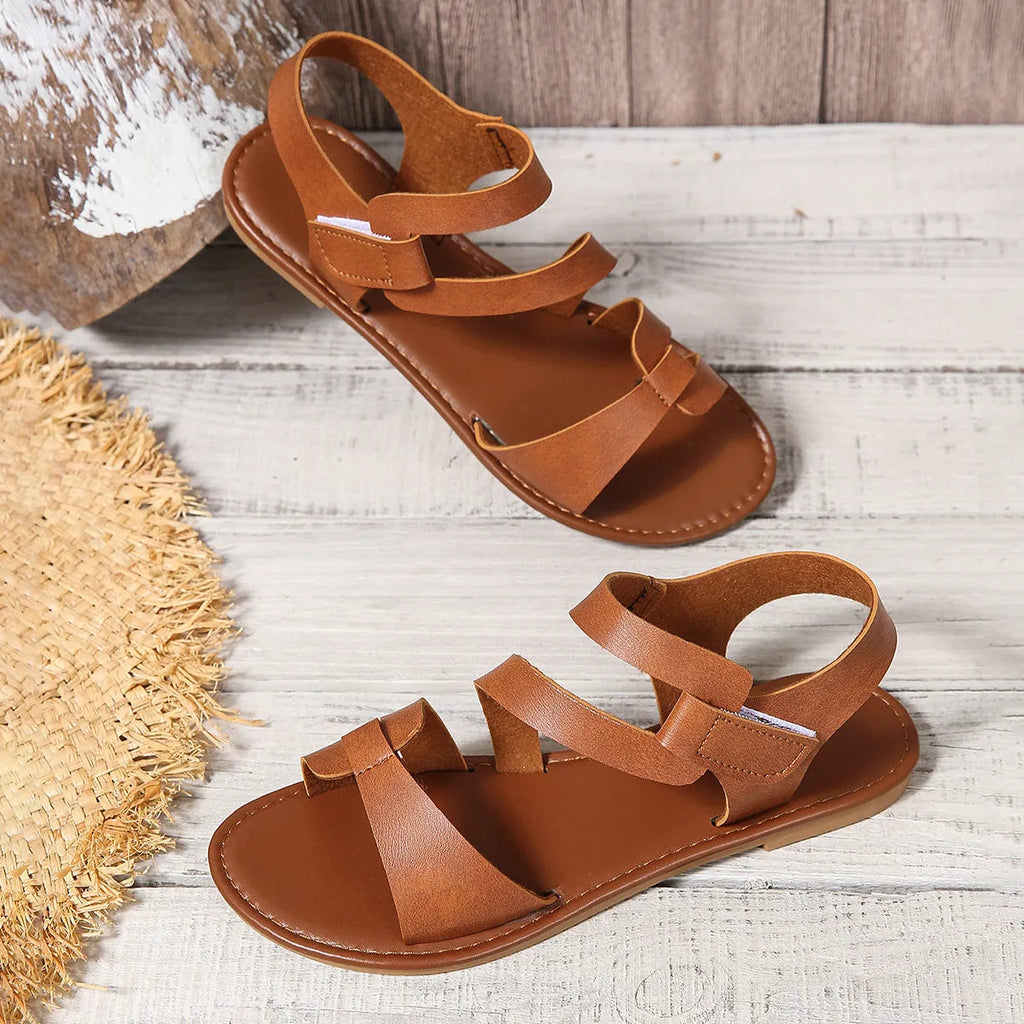 Women's flat sandals with Velcro strap in colourful, brown, and black colour options