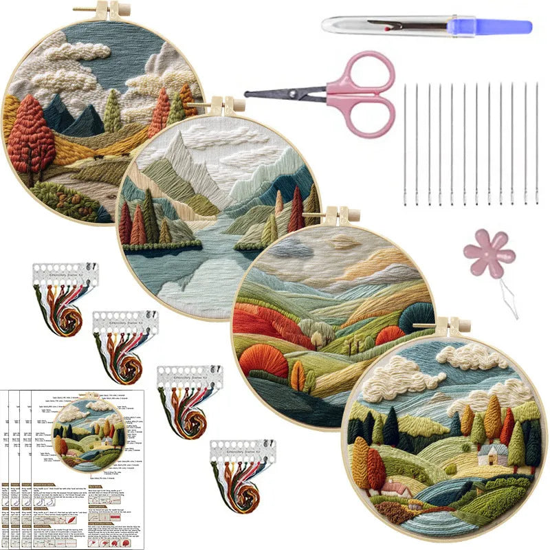 Embroidery kit with printed landscape fabric, thread, bamboo frame, and needles arranged for DIY cloth art