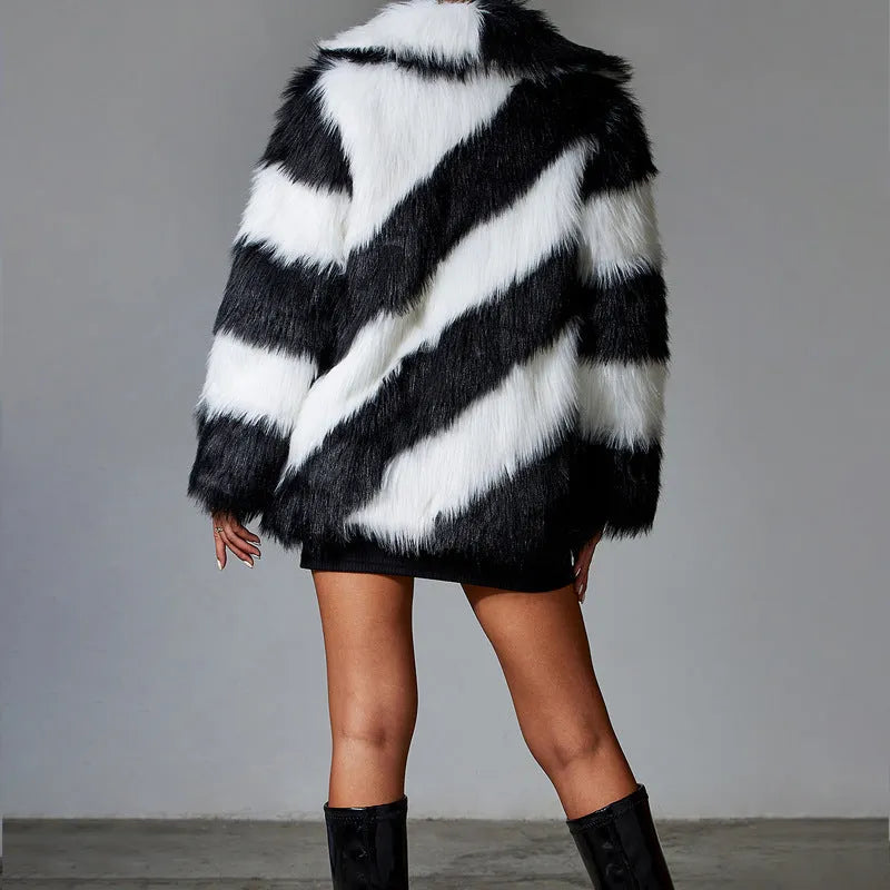 Women's faux fur coat with contrasting lapel detail and a detachable fur collar.