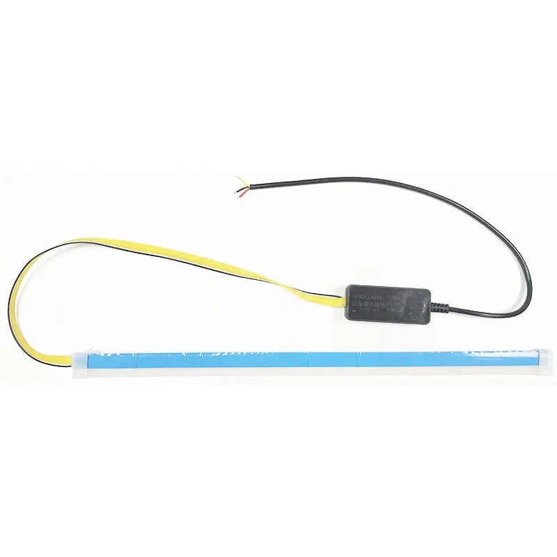 Universal car LED daytime running light strip with flowing turn signal on a vehicle headlight.