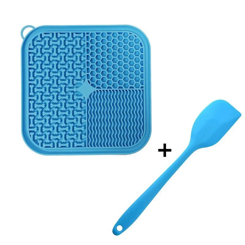 Blue silicone dog licking mat with textured pattern and suction cups on back