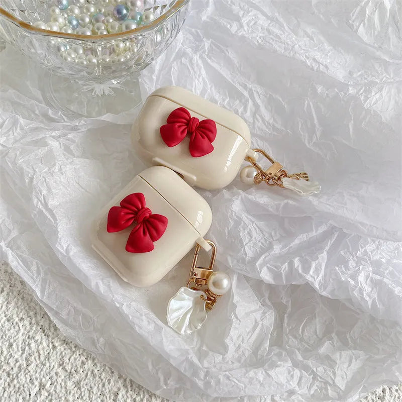Beige red bow shell patterned TPU protective case for AirPods Pro and other models.