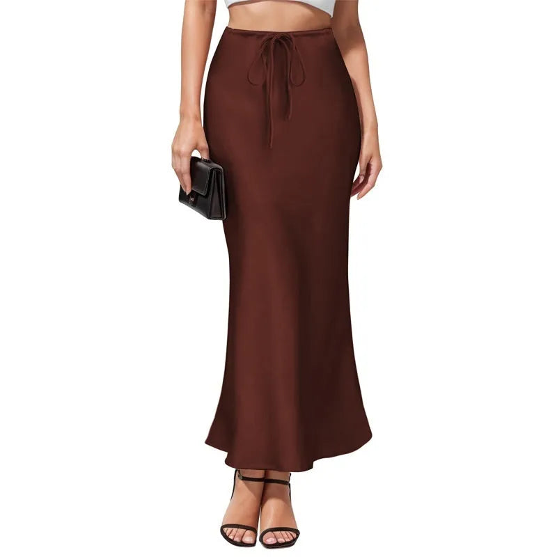 High-waisted asymmetric acetate skirt in a solid colour with irregular stitching detail on the hem.