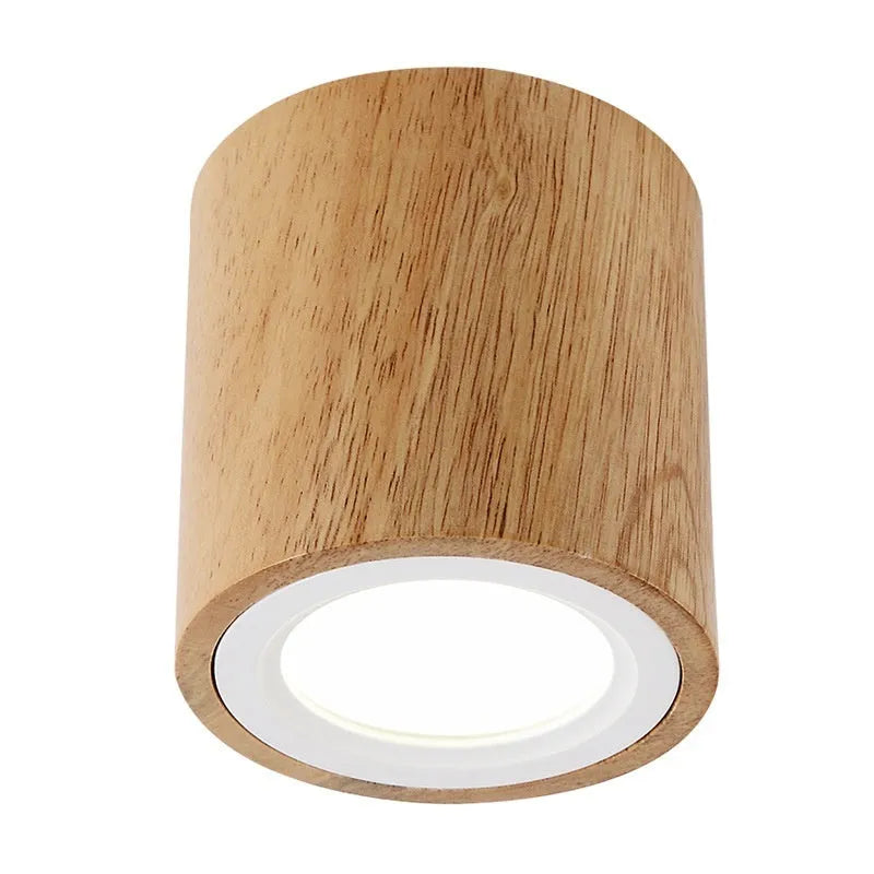 Solid wood surface mounted downlight in wood colour with square or round design options