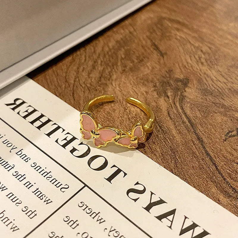 Copper women's ring featuring a creative Chinese butterfly design, available in multiple colours.