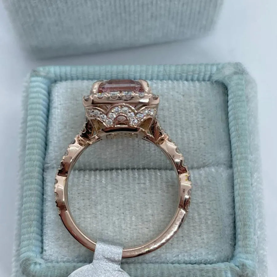 Rose gold electroplated alloy ring with geometrical design shown on hand