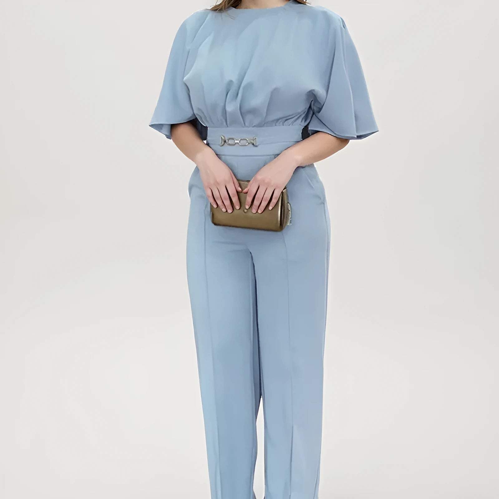 Blue men's two-piece suit with long sleeve jacket and trousers on a hanger
