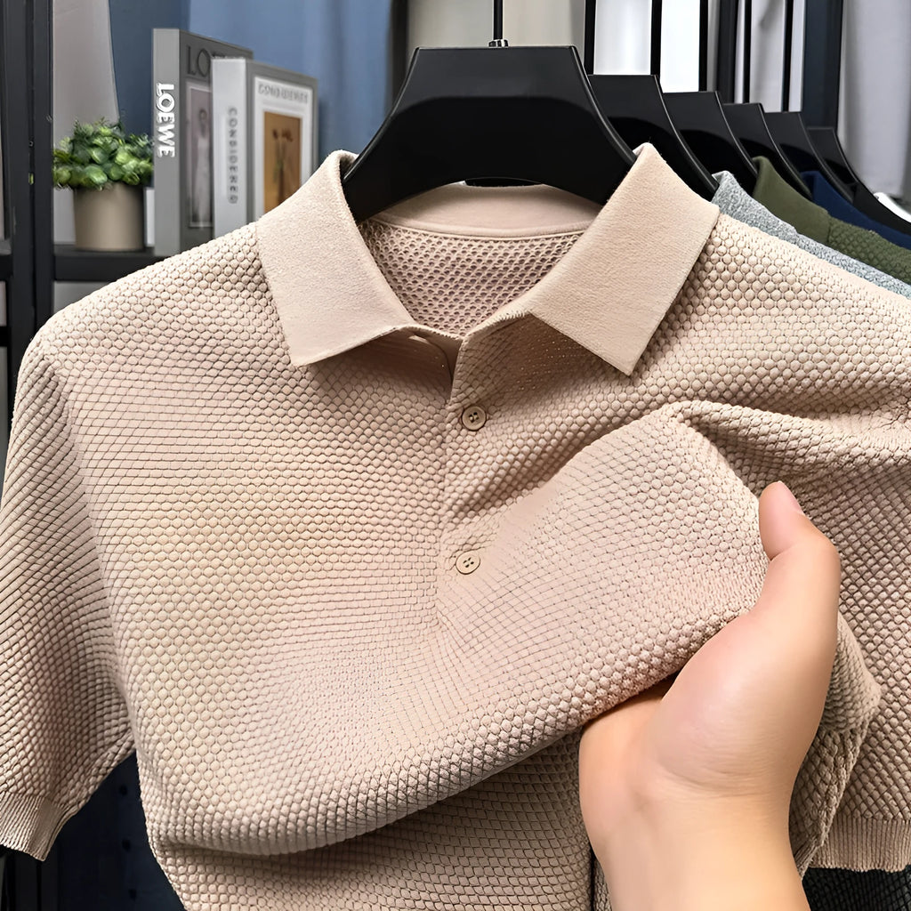 Loose fitting short sleeve cotton sweater in a neutral colour, showing pullover style and casual fit.