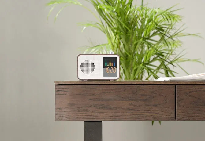 Brown wooden retro Bluetooth speaker with AM/FM radio, brass tuning dials and analogue display