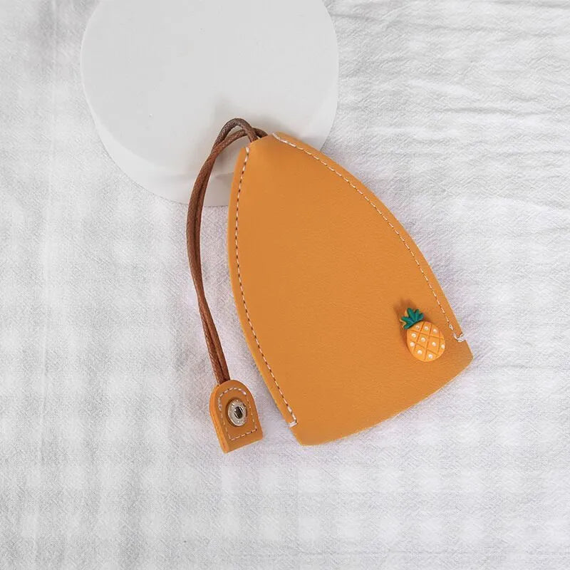 Cartoon pull-out car key case in PU leather with colourful designs measuring 14 x 7.5 cm