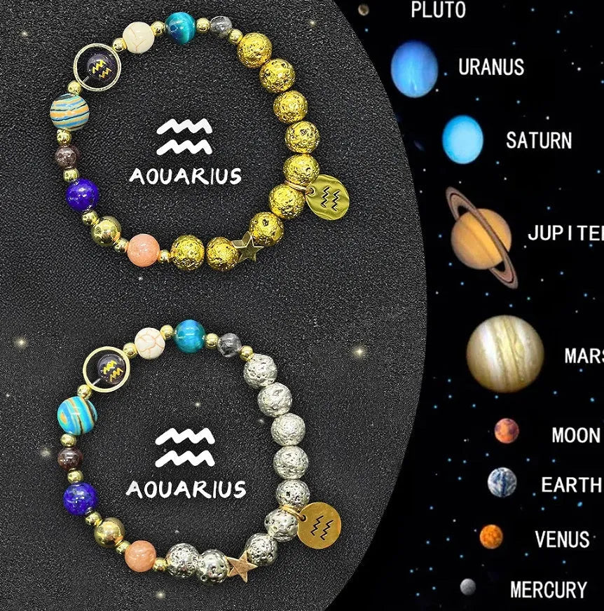 Two natural stone beaded bracelets showing zodiac sign charms on a wooden surface.