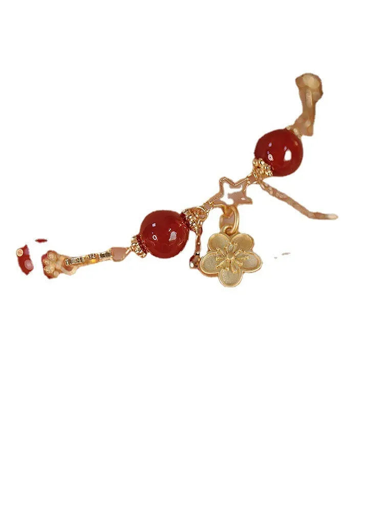 Red agate double layer bracelet for women with carved peach blossom and flower designs.