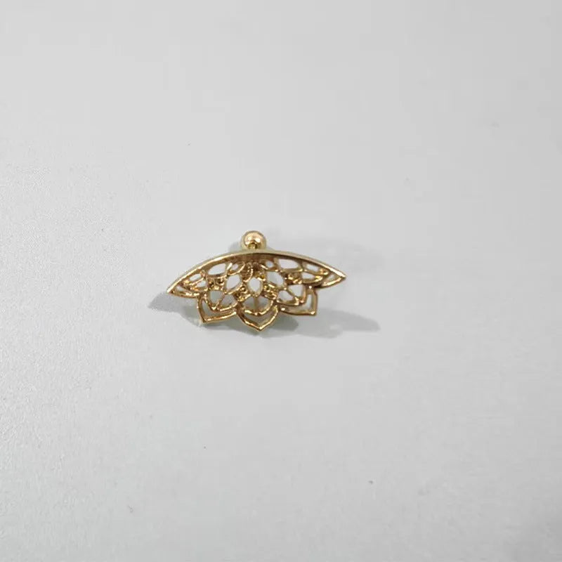 A pair of geometric spider web design stud earrings in an electroplated gold finish.