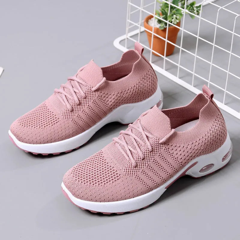 Women's black mesh casual sneakers with round toe and white lace-up front on a soft non-slip sole.