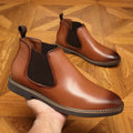Men's black formal pointed-toe leather boots with a square heel on a white background