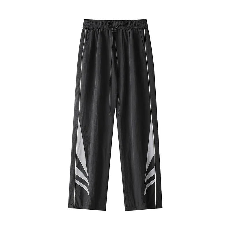 Men's straight cut casual trousers in black with elastic waistband and cardigan button detail