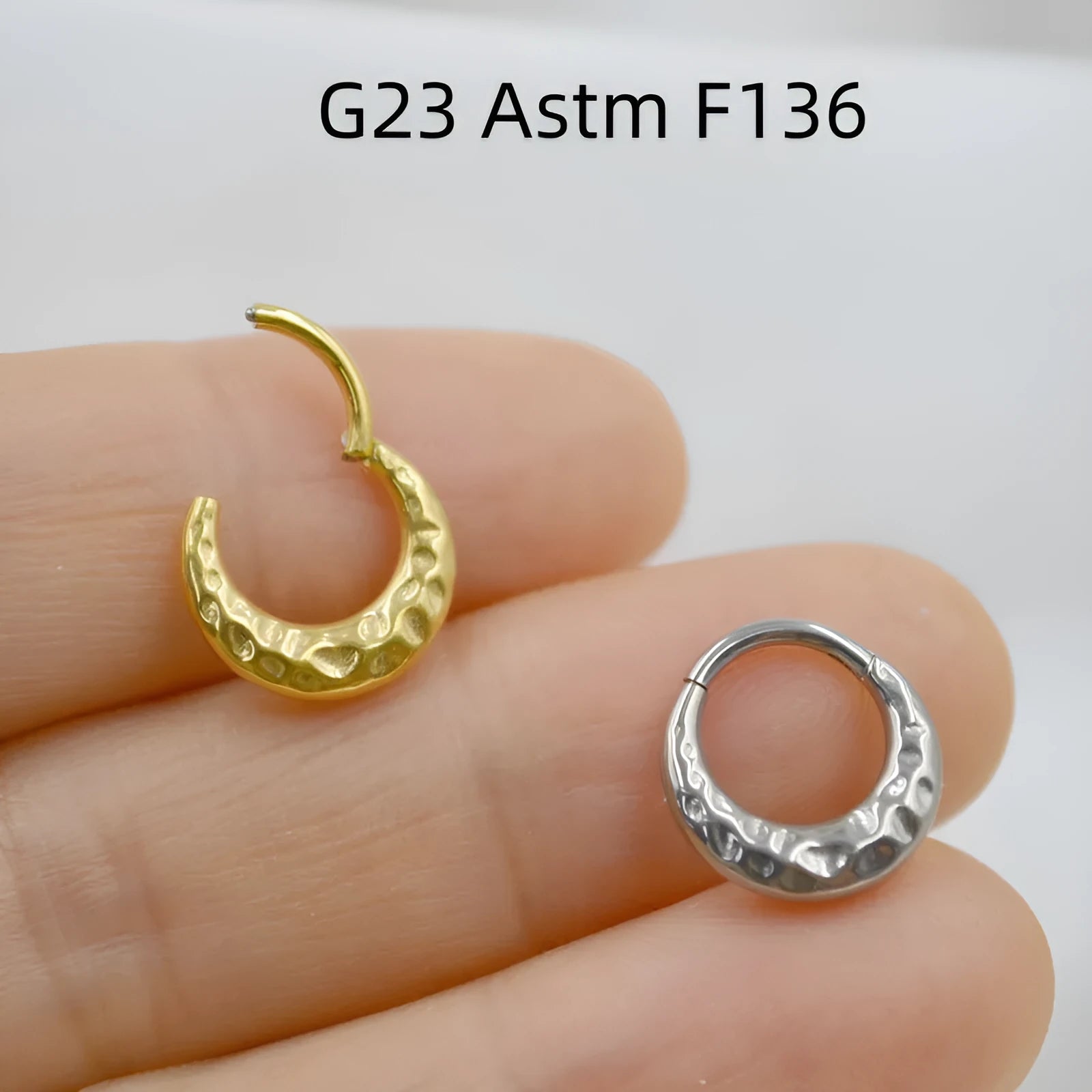 ASTM F136 titanium alloy nose ring with concave-convex carved design in gold or silver.