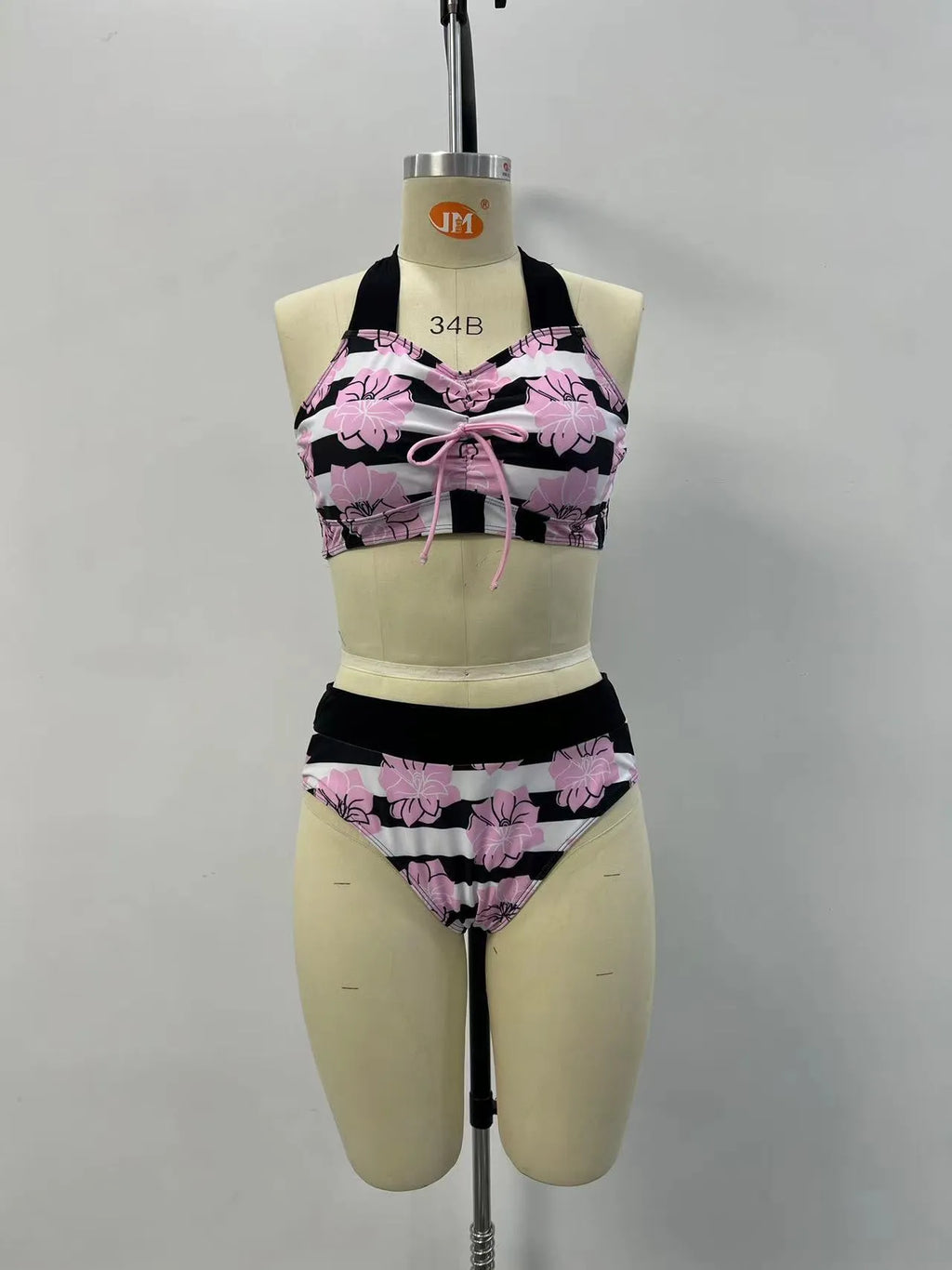 Black women's printed split bikini with high-waisted brief for belly coverage.