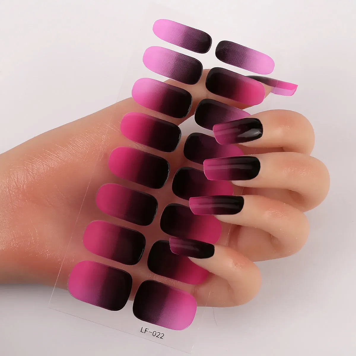 Sheet of 16 solid colour nail art sticker designs including cross, rose, and leopard print patterns.