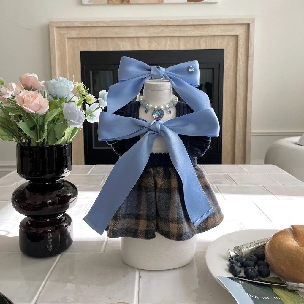 Dog wearing princess style bow hair band with tension adjustment on head