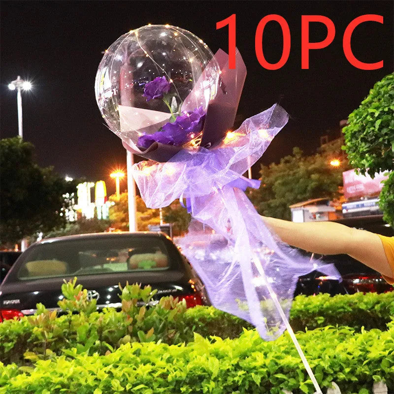 Transparent LED luminous balloon bouquet with artificial rose and glowing light inside, displayed as a DIY kit.