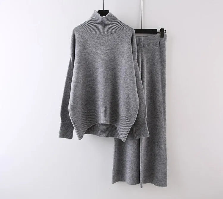 Women's solid colour sweater and wide leg trousers two-piece set in beige, shown as a coordinated outfit.