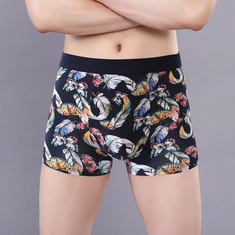 Men's cotton boxer shorts in a floral pattern, showing the mid-waist fit and U-shaped convex design.