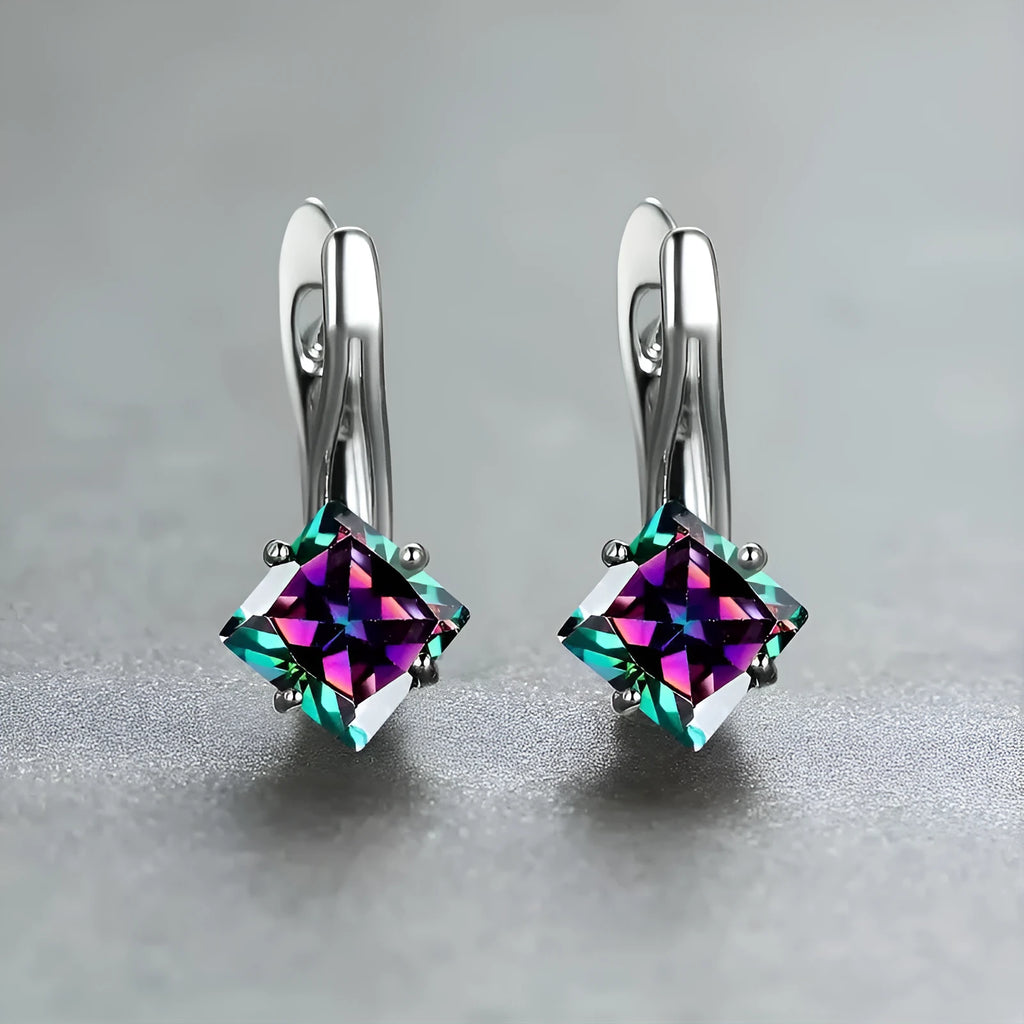 A pair of women's copper earrings with an inlaid zircon diamond design, shown in blue, green, and colour variations.