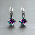 A pair of women's copper earrings with an inlaid zircon diamond design, shown in blue, green, and colour variations.